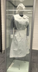 Old fashioned student nurse's uniform with cap and apron